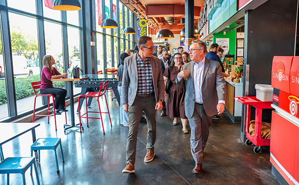 New York Fed President John Williams tours Salt City Market in Syracuse, New York.