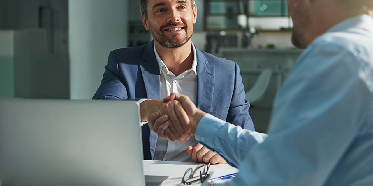 Business people, handshake and interview success or recruitment, employment and hiring in office. Corporate, men and executive shaking hands with new employee or collaboration on deal or partnership.